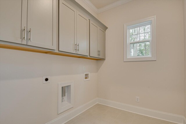 clothes washing area with washer hookup, electric dryer hookup, cabinets, and crown molding