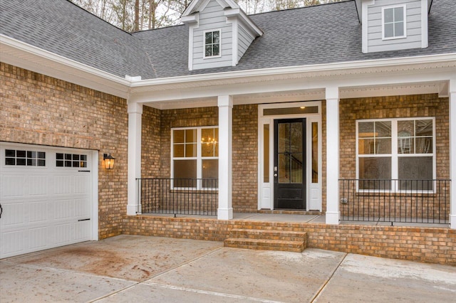 property entrance with a garage and covered porch