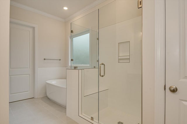 bathroom with plus walk in shower, tile patterned flooring, and crown molding