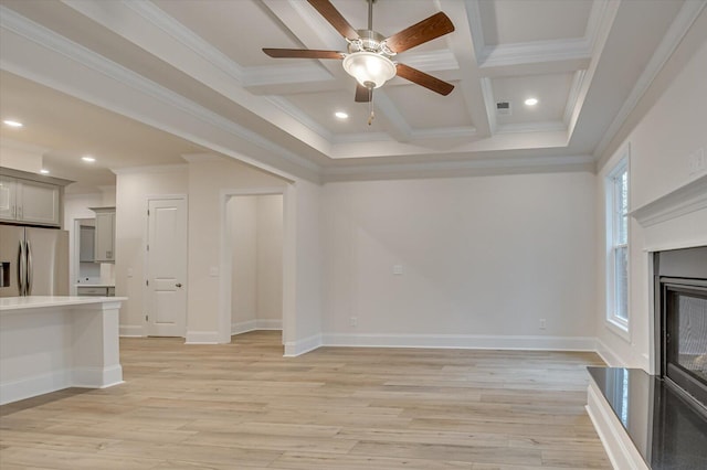 unfurnished living room with beamed ceiling, ornamental molding, light wood-type flooring, and coffered ceiling