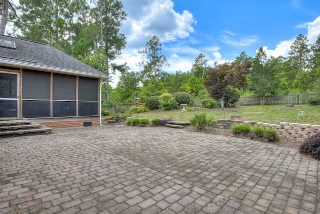 79 Loggerhead Dr, Columbia, SC 29229 - fenced backyard with a patio, a sunroom, and view of scattered trees