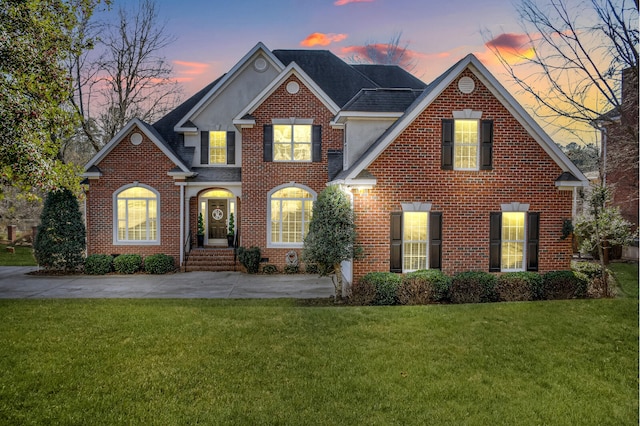 view of front property with a yard