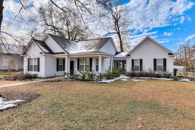 view of front of home featuring a front yard and a porch