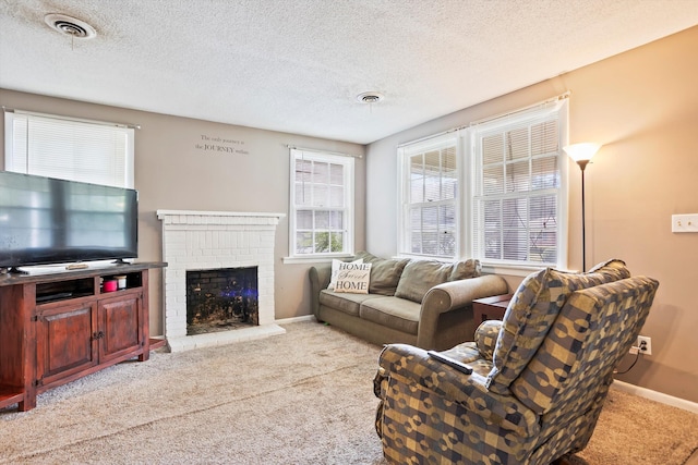 520 Central Rd, Thomson, GA 30824 - living area featuring carpet flooring, baseboards, a brick fireplace, and a textured ceiling