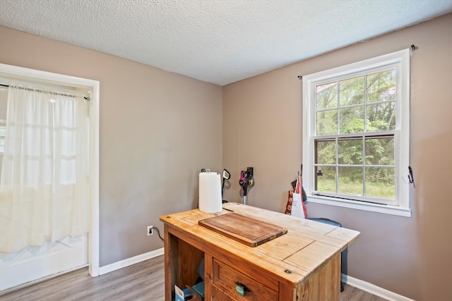 520 Central Rd, Thomson, GA 30824 - office space with light wood-style flooring, baseboards, and a textured ceiling