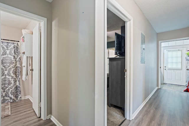 520 Central Rd, Thomson, GA 30824 - hallway with electric panel, wood finished floors, and baseboards