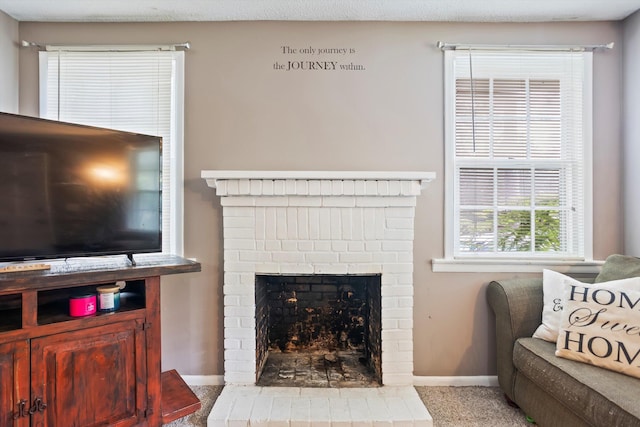 520 Central Rd, Thomson, GA 30824 - living area featuring baseboards, carpet flooring, and a fireplace