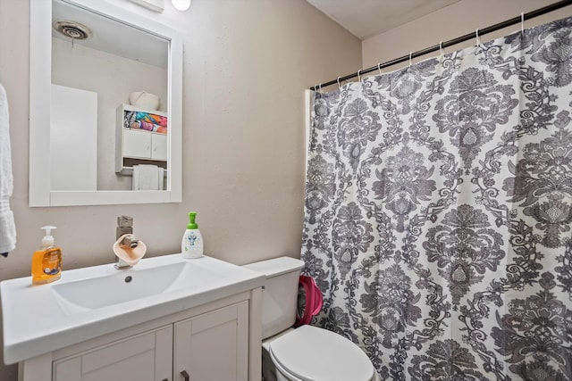 520 Central Rd, Thomson, GA 30824 - bathroom featuring vanity, toilet, and a shower with shower curtain