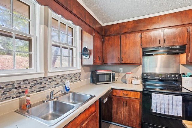 520 Central Rd, Thomson, GA 30824 - kitchen with black appliances, under cabinet range hood, a sink, ornamental molding, and a textured ceiling