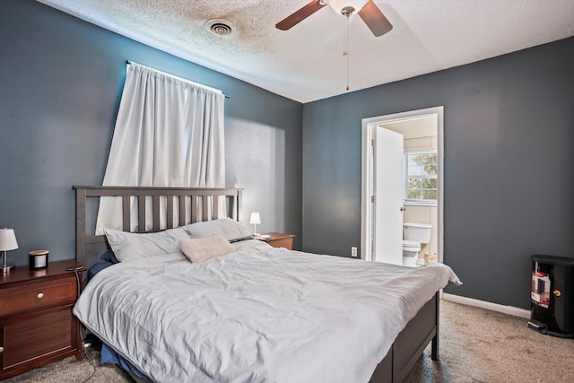520 Central Rd, Thomson, GA 30824 - carpeted bedroom featuring a textured ceiling, connected bathroom, a ceiling fan, and baseboards