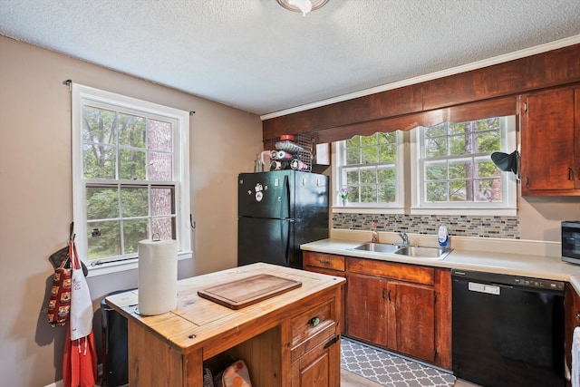 520 Central Rd, Thomson, GA 30824 - kitchen featuring black appliances, wood counters, a sink, plenty of natural light, and a textured ceiling