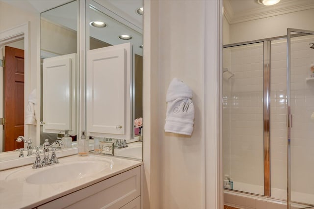 full bath with vanity, a shower stall, recessed lighting, and ornamental molding