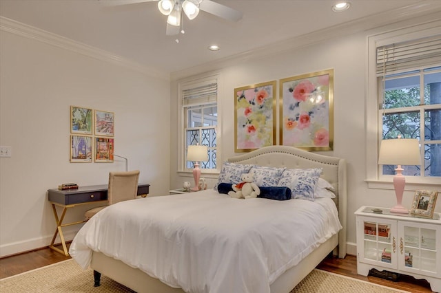 bedroom with crown molding, recessed lighting, wood finished floors, and baseboards