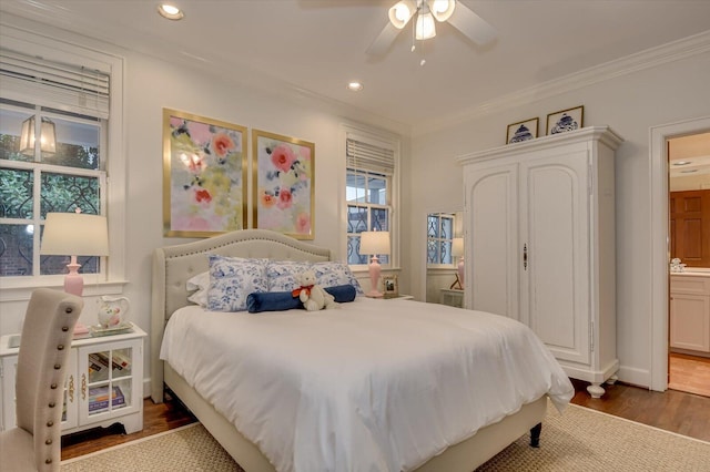 bedroom with crown molding, ceiling fan, recessed lighting, wood finished floors, and ensuite bath