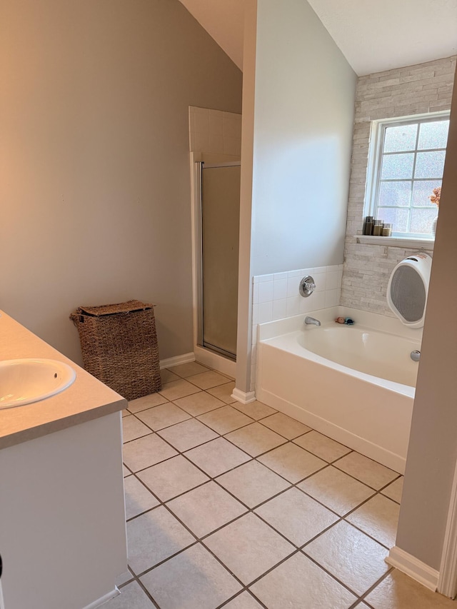 1229 Creek Bend Dr, Grovetown, GA 30813 - full bathroom with tile patterned floors, a garden tub, a stall shower, vanity, and lofted ceiling