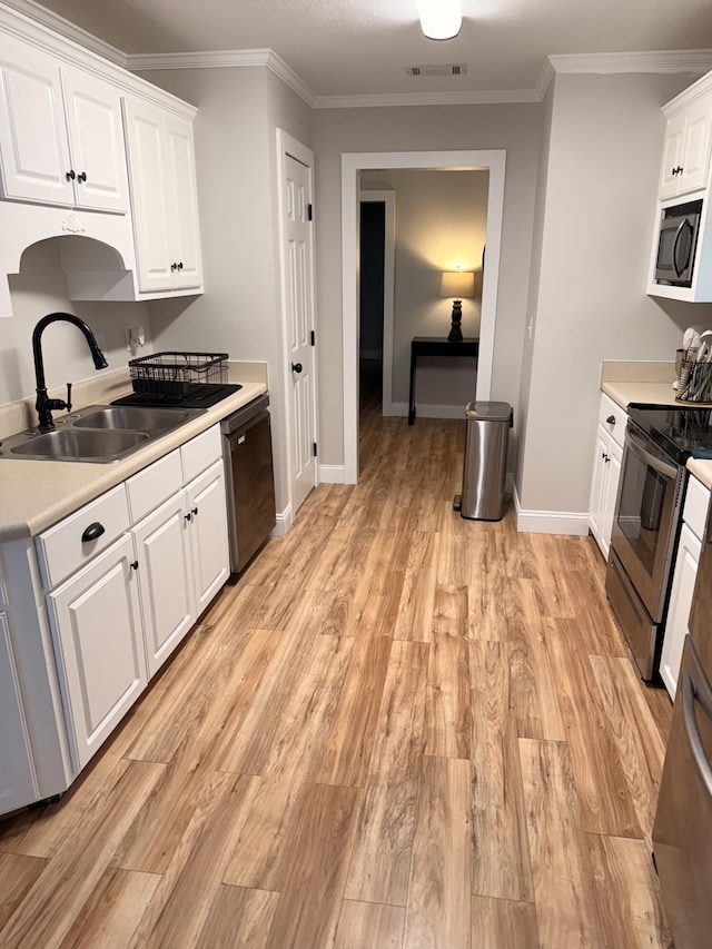 1229 Creek Bend Dr, Grovetown, GA 30813 - kitchen with dishwasher, stainless steel electric range, a sink, white cabinets, and light wood-type flooring