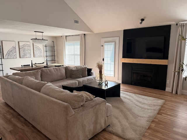 1229 Creek Bend Dr, Grovetown, GA 30813 - living room featuring a fireplace, wood finished floors, and vaulted ceiling