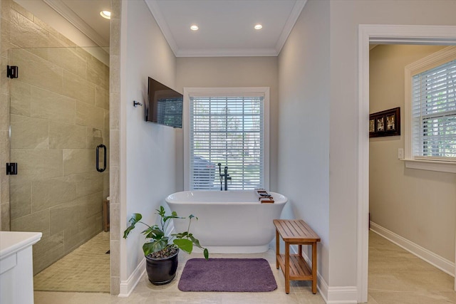 bathroom with tile patterned floors, vanity, separate shower and tub, and crown molding