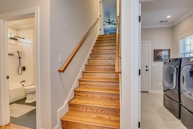 stairway with washer and dryer and ornamental molding