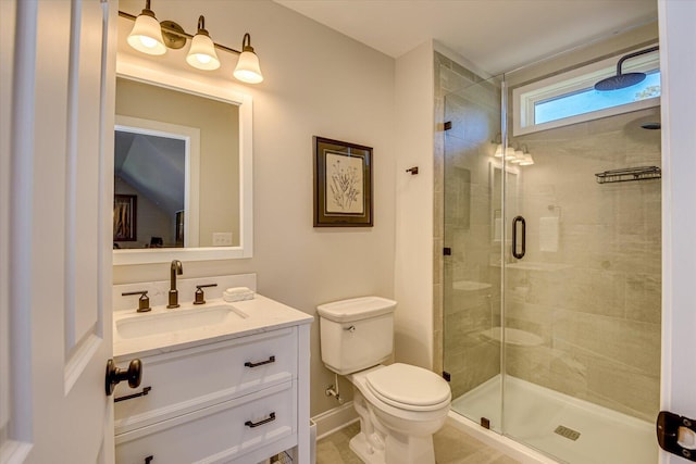 bathroom with vanity, an enclosed shower, and toilet