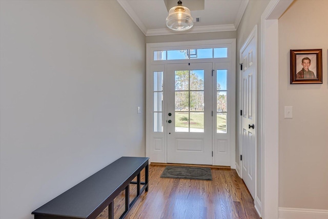 doorway to outside featuring crown molding and hardwood / wood-style floors