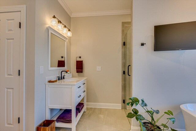 bathroom with vanity, an enclosed shower, and ornamental molding