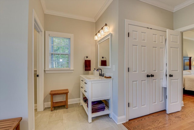 bathroom featuring vanity, wood-type flooring, and ornamental molding