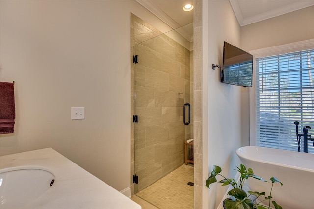 bathroom featuring vanity, ornamental molding, and independent shower and bath