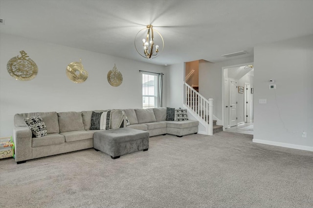 living room with carpet and an inviting chandelier