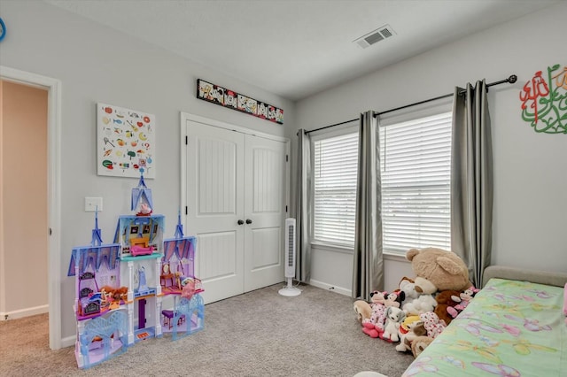 carpeted bedroom featuring a closet