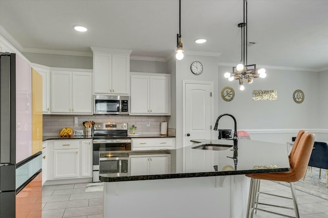 kitchen with white cabinetry, sink, a center island with sink, and appliances with stainless steel finishes