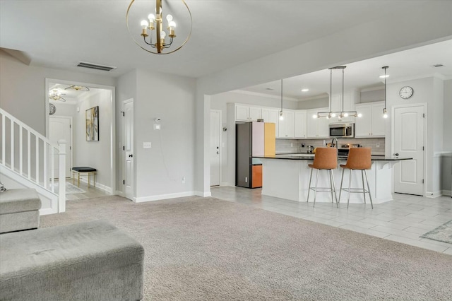 interior space with crown molding and an inviting chandelier