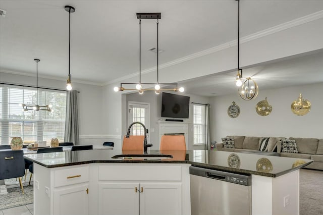 kitchen featuring white cabinetry, sink, ornamental molding, a kitchen island with sink, and stainless steel dishwasher