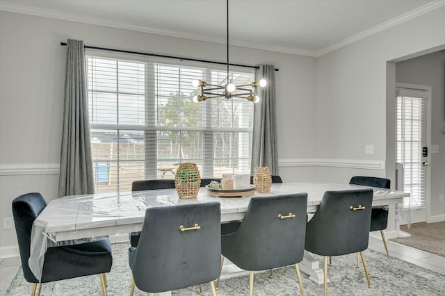 dining room with crown molding, a notable chandelier, and light tile patterned floors