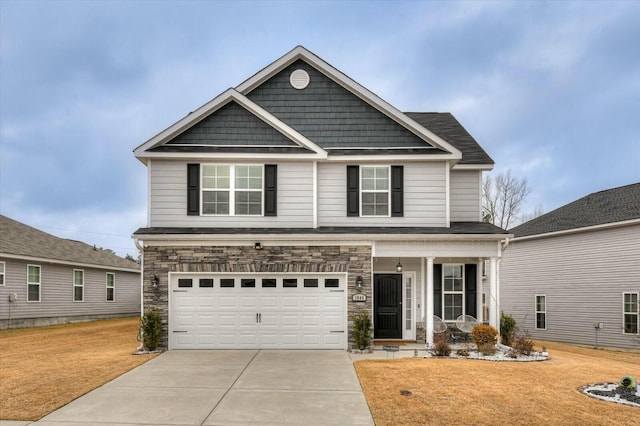 view of front of house with a garage and a front lawn