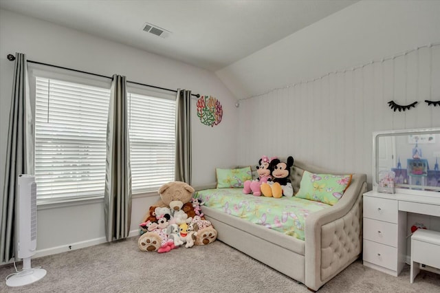 bedroom featuring lofted ceiling and light colored carpet