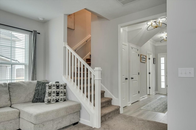 entryway featuring a notable chandelier and light wood-type flooring