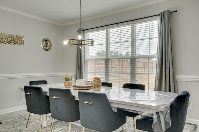 dining room featuring ornamental molding and a chandelier