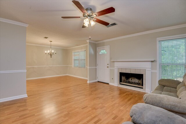 2516 Commons Trce, Augusta, GA 30909 - living area with plenty of natural light, a ceiling fan, a chandelier, light wood-type flooring, and ornamental molding
