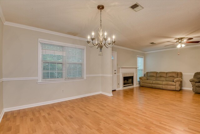 2516 Commons Trce, Augusta, GA 30909 - living area with light wood-style floors, ornamental molding, a chandelier, a ceiling fan, and baseboards