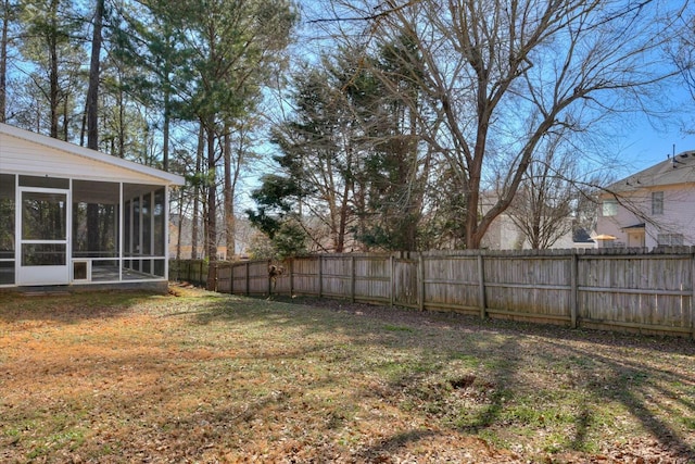 view of yard featuring a sunroom