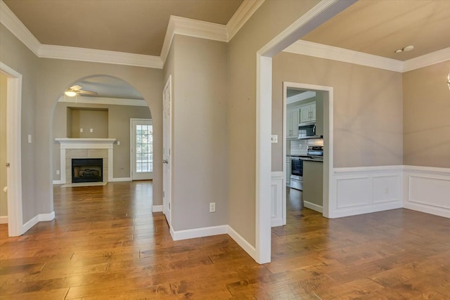 interior space with hardwood / wood-style flooring and crown molding