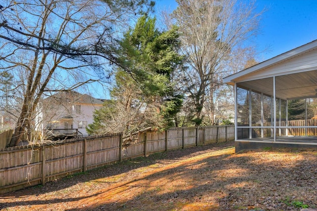 view of yard with a sunroom