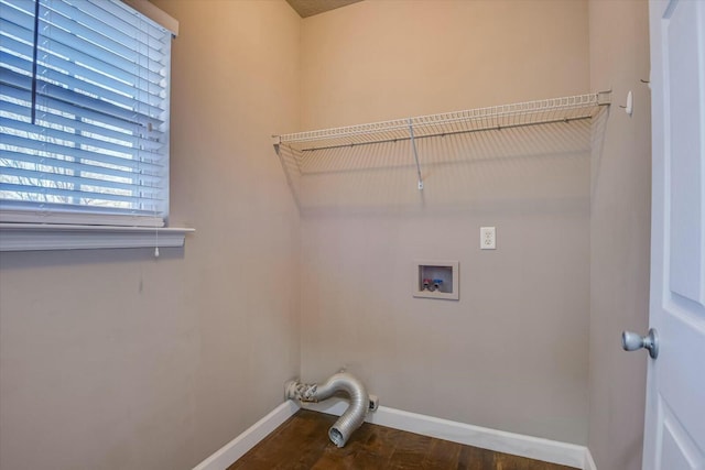 laundry area with washer hookup and dark hardwood / wood-style flooring