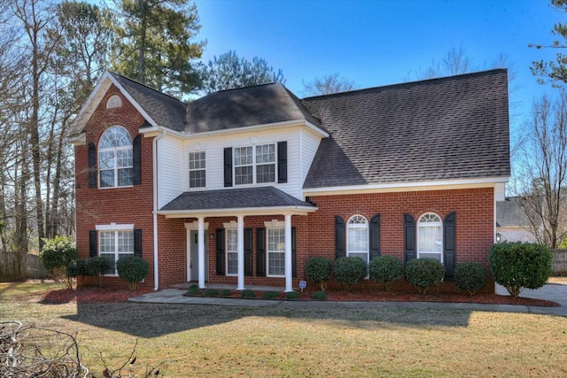 view of front of house featuring a front yard and a porch