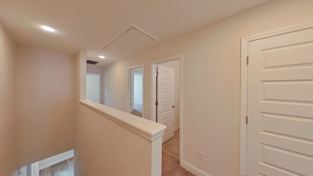 corridor featuring visible vents, recessed lighting, an upstairs landing, and baseboards