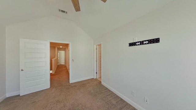 unfurnished bedroom with lofted ceiling, ceiling fan, light carpet, visible vents, and baseboards