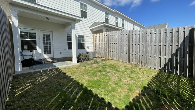 view of yard featuring cooling unit and a fenced backyard