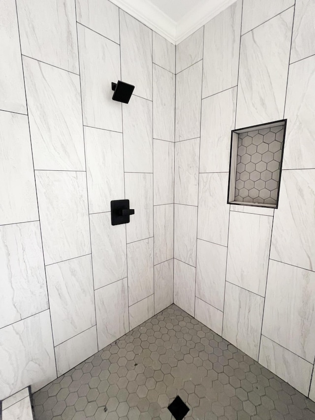 bathroom featuring walk in shower and ornamental molding