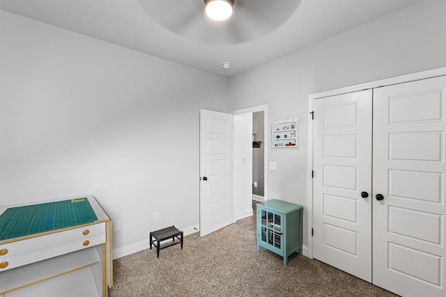 miscellaneous room featuring carpet floors and ceiling fan